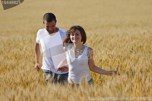 Image of happy couple in wheat field