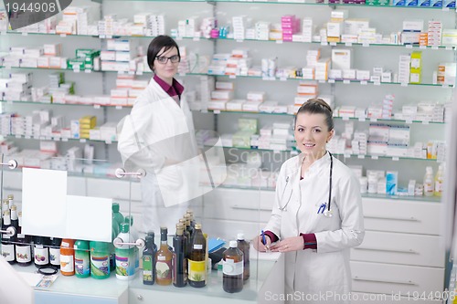 Image of team of pharmacist chemist woman  in pharmacy drugstore