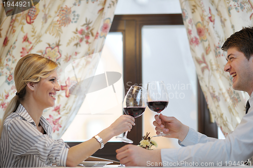 Image of young couple having dinner at a restaurant