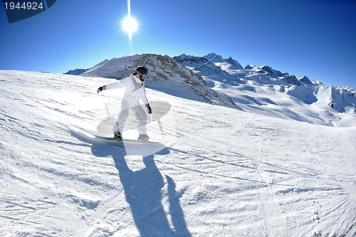Image of skiing on fresh snow at winter season at beautiful sunny day