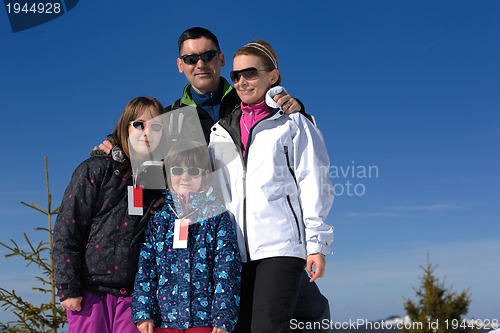 Image of portrait of happy young family at winter