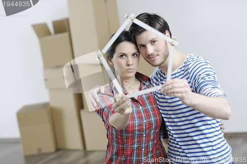 Image of Young couple moving in new home