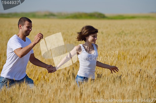 Image of happy couple in wheat field
