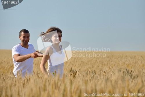 Image of happy couple in wheat field