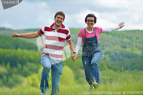 Image of romantic young couple in love together outdoor