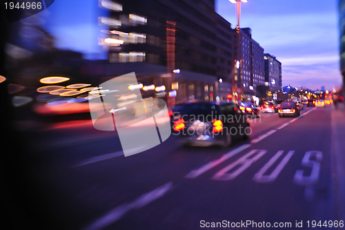 Image of City night with cars motion blurred light in busy street