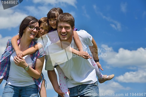 Image of happy young family have fun outdoors