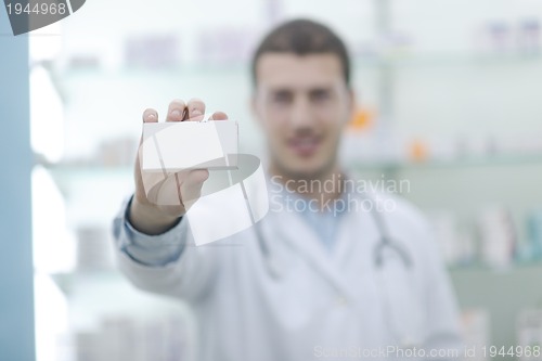 Image of pharmacist chemist man in pharmacy drugstore