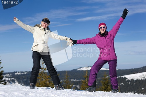 Image of winter season fun with group of girls