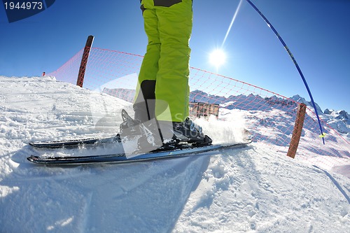 Image of skiing on fresh snow at winter season at beautiful sunny day