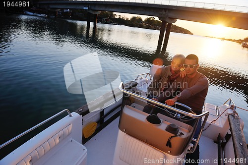 Image of couple in love  have romantic time on boat