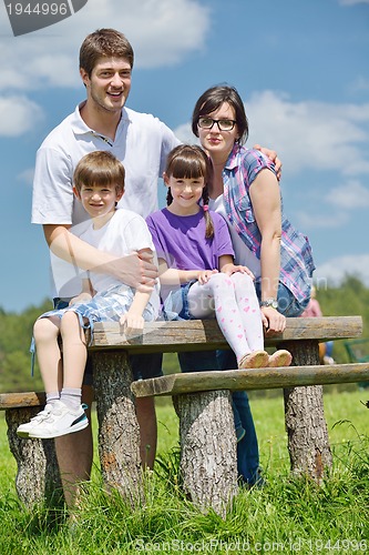 Image of happy young family have fun outdoors