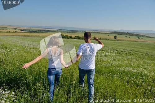 Image of happy couple in wheat field
