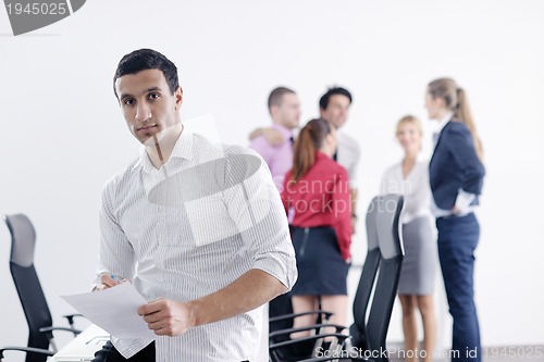 Image of young business man at meeting