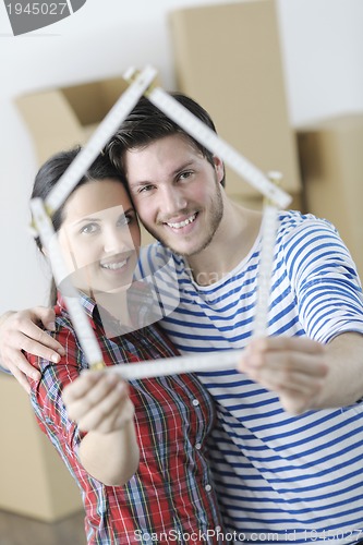 Image of Young couple moving in new home