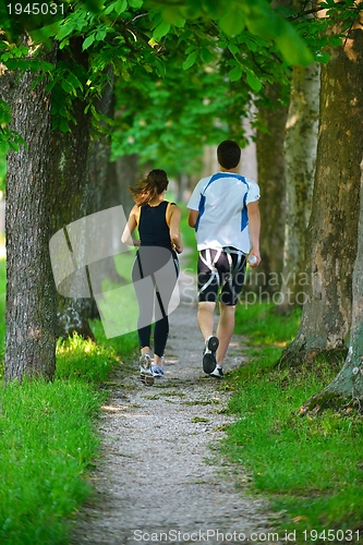 Image of Young couple jogging