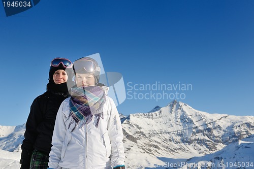 Image of winter portrait of friends at skiing