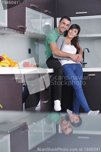 Image of young couple have fun in modern kitchen