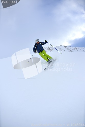 Image of skiing on fresh snow at winter season at beautiful sunny day