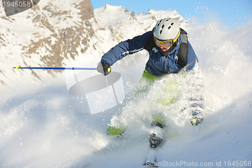 Image of skiing on fresh snow at winter season at beautiful sunny day