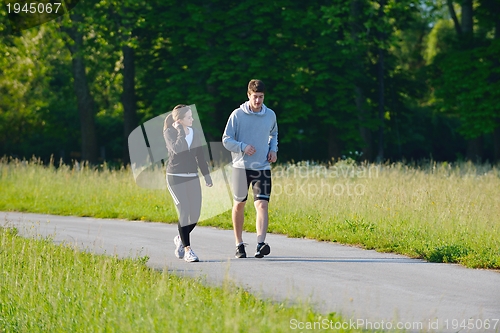 Image of Young couple jogging