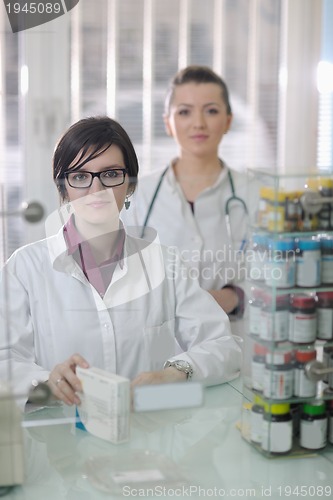 Image of team of pharmacist chemist woman  in pharmacy drugstore