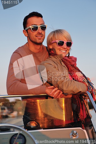 Image of couple in love  have romantic time on boat