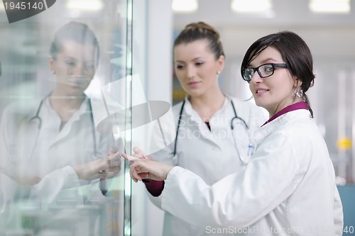 Image of team of pharmacist chemist woman  in pharmacy drugstore