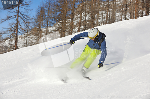 Image of skiing on fresh snow at winter season at beautiful sunny day