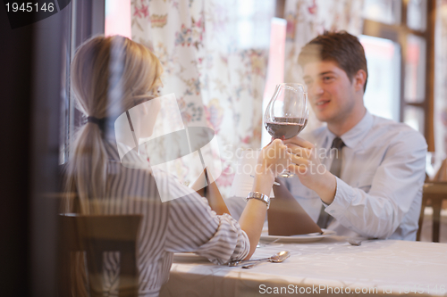 Image of young couple having dinner at a restaurant