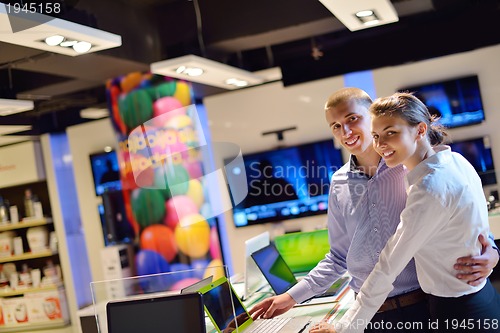 Image of people buy  in consumer electronics store