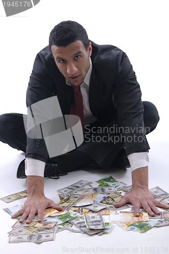 Image of Business man holding money