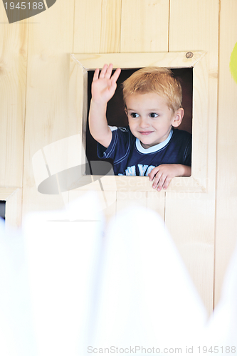 Image of happy child in a window