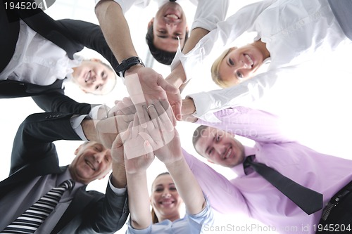 Image of business people group joining hands