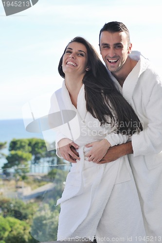 Image of couple relaxing on balcony