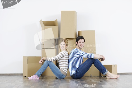 Image of Young couple moving in new home