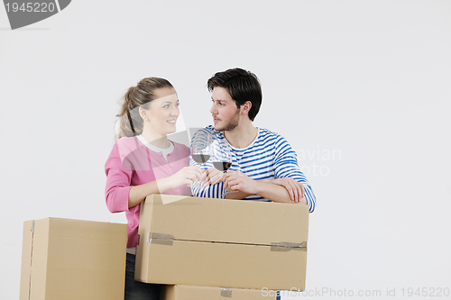 Image of Young couple moving in new home