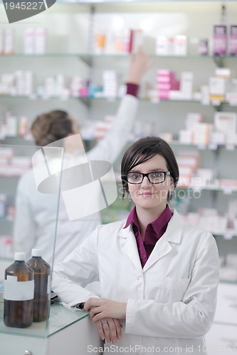 Image of team of pharmacist chemist woman  in pharmacy drugstore