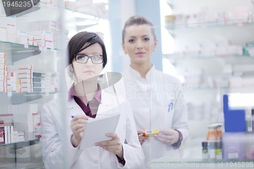 Image of team of pharmacist chemist woman  in pharmacy drugstore