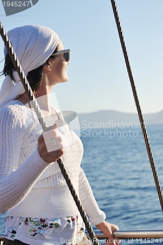 Image of Greek woman on the streets of Oia, Santorini, Greece