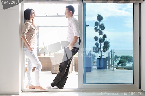 Image of happy young couple relax at home