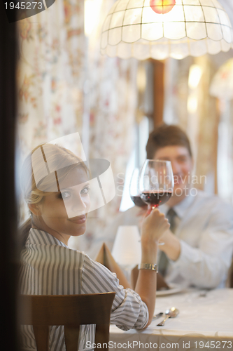 Image of young couple having dinner at a restaurant