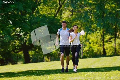 Image of Young couple jogging