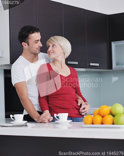 Image of young couple have fun in modern kitchen