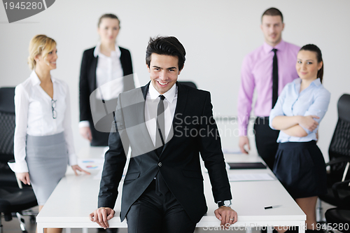 Image of young business man at meeting