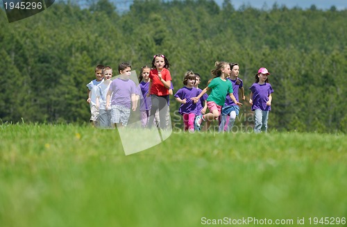 Image of happy kids group  have fun in nature