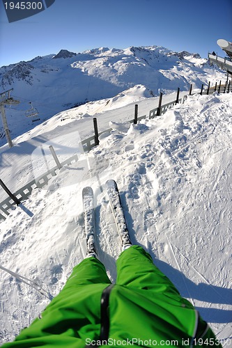 Image of skiing on fresh snow at winter season at beautiful sunny day