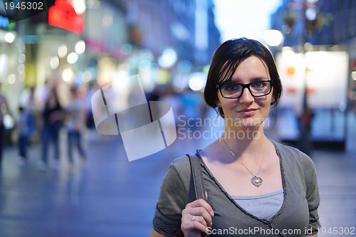 Image of woman portrait at night in city