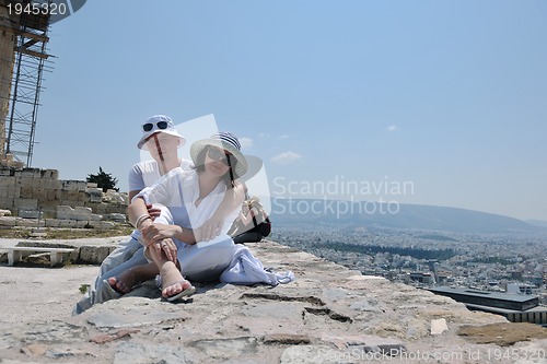 Image of happy young couple tourists in greece