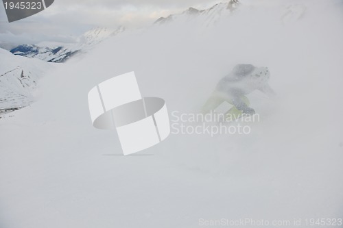 Image of skiing on fresh snow at winter season at beautiful sunny day